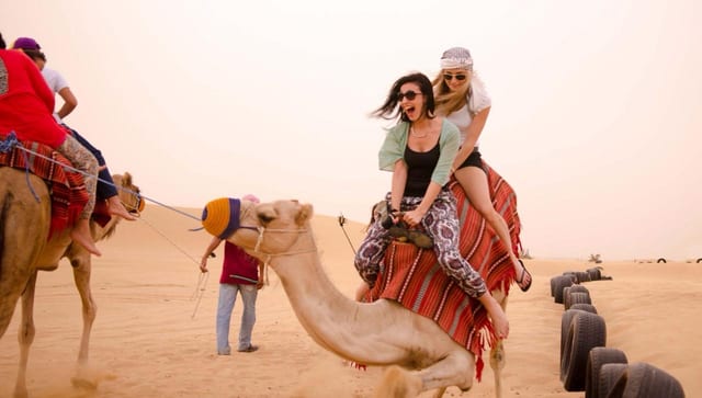 VIP dubai desert Safari camel ride BBQ Dinner & Dune Bashing 4×4