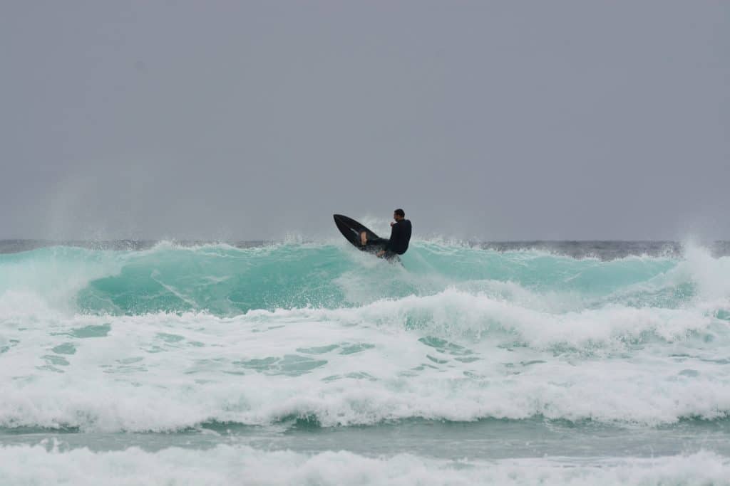 Surfing at Watergate Bay Beach Newquay - adventuro