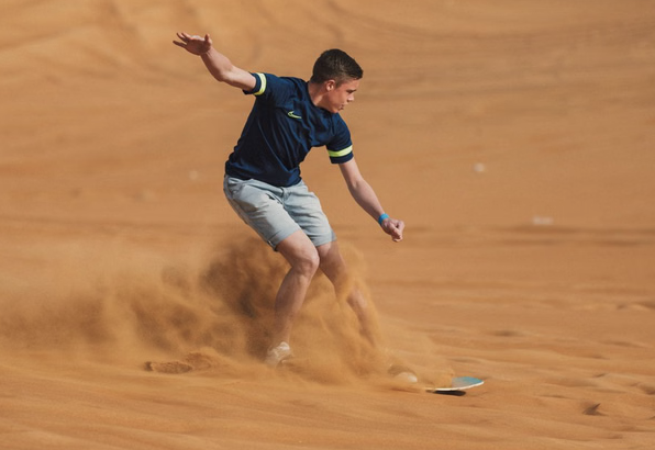 Early Morning Desert Buggy Experience with Sandboarding & Camel Interaction gallery 3